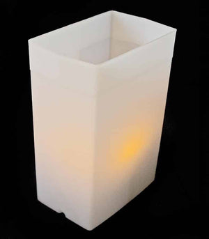 White Luminary with amber LED Tealight inside